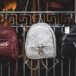brown leather backpack on brown wooden table