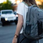 woman using gray backpack