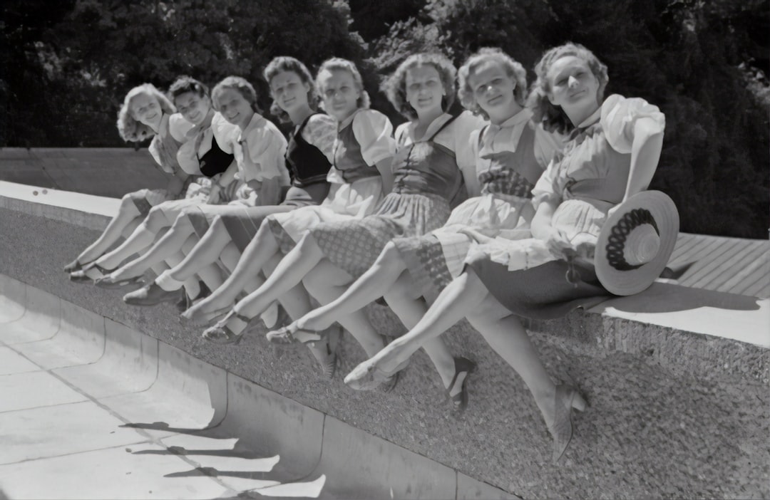 Salzburg Festival 1946 by Backpack Brands grayscale photo of group of women sitting on concrete bench