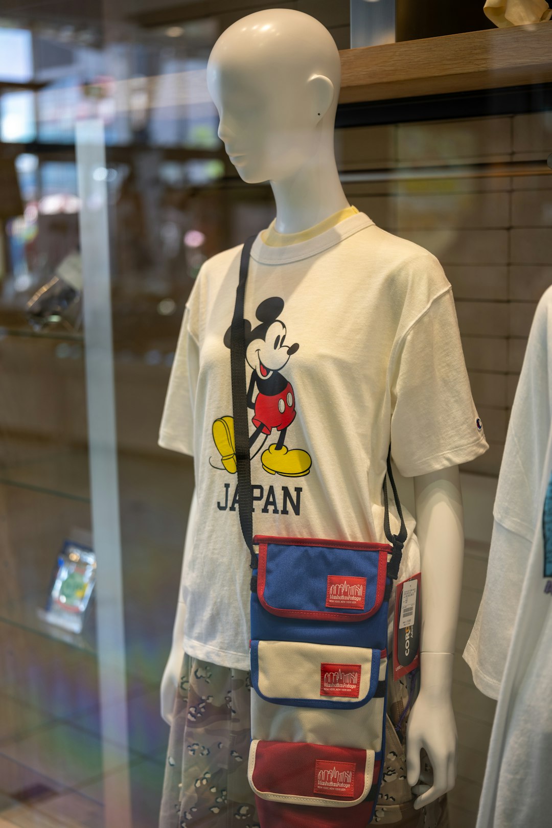 FAQ: Your Burning Backpack Questions Answered by Backpack Brands a display case with a mickey mouse t - shirt on it