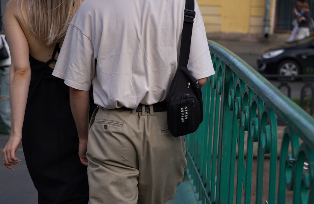 A man and a woman walking down a street